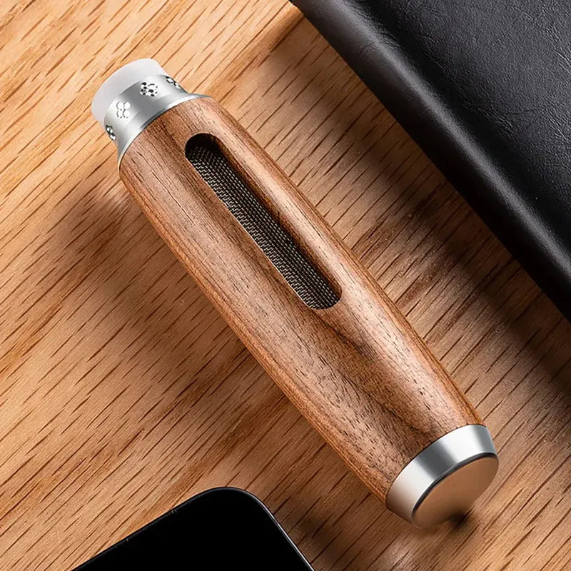 Wooden-handled tool with metallic ends on a wooden surface