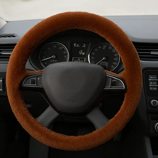Brown steering cover on a car steering wheel with dashboard in the background